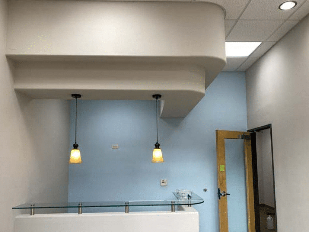 Commercial office desk area freshly painted with clean, modern colors and smooth, professional finishes in Tucson.