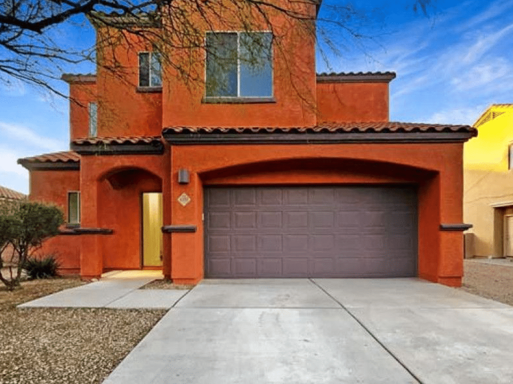 Tucson home exterior painted in rich dark sienna House exterior painting with durable finish for Arizona climate